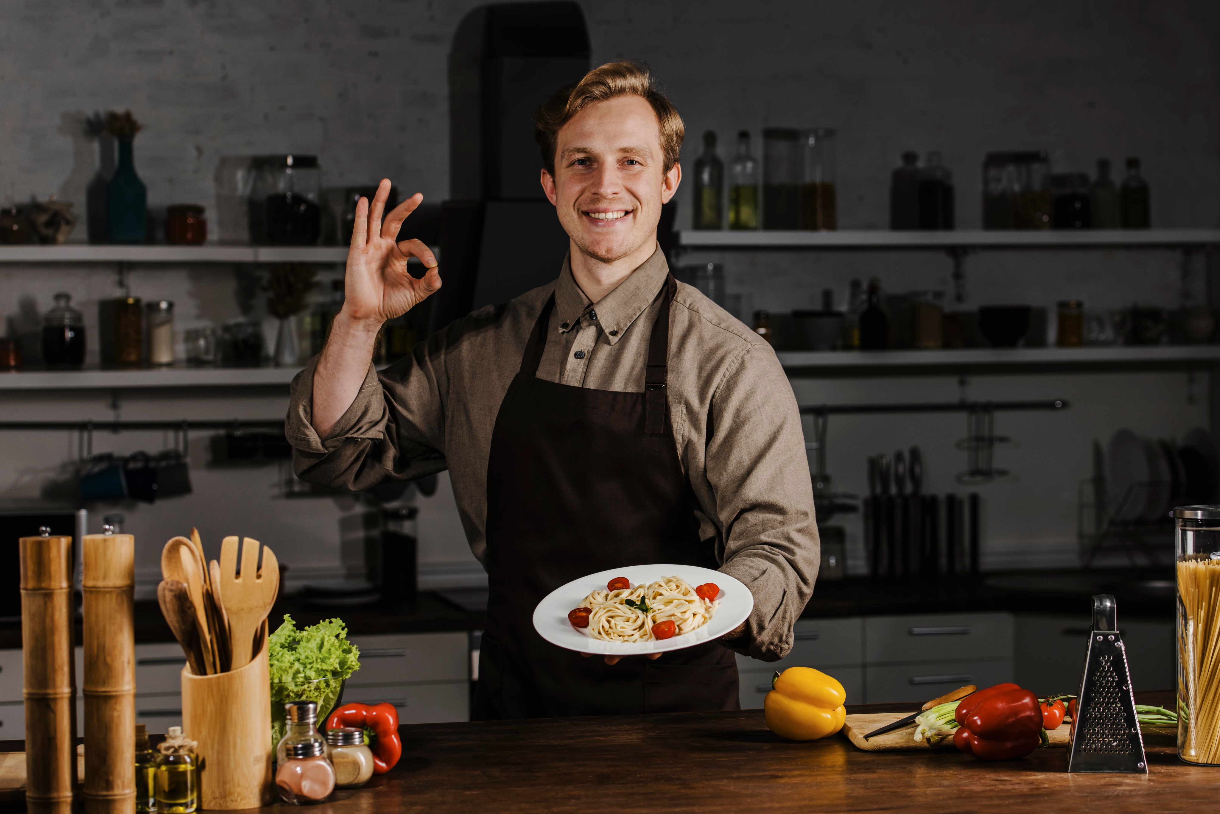 Chef holding a plated dish